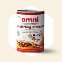 Can of Omni Comforting Casserole dog food on a beige background