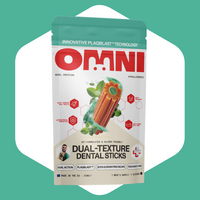 Package of Omni Dual-Texture Dental Sticks on a green background