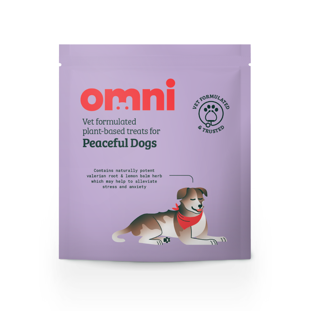 Purple package of 'omni' dog treats for peaceful dogs on a white background