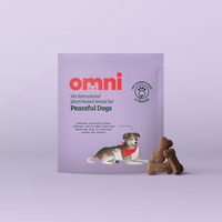 Purple package of 'omni' dog treats with a dog illustration on a light purple background