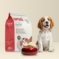 Puppy with a bowl of food and an Omni pet food package on a beige background