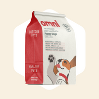 Omi dog food package for puppy dogs on a beige background